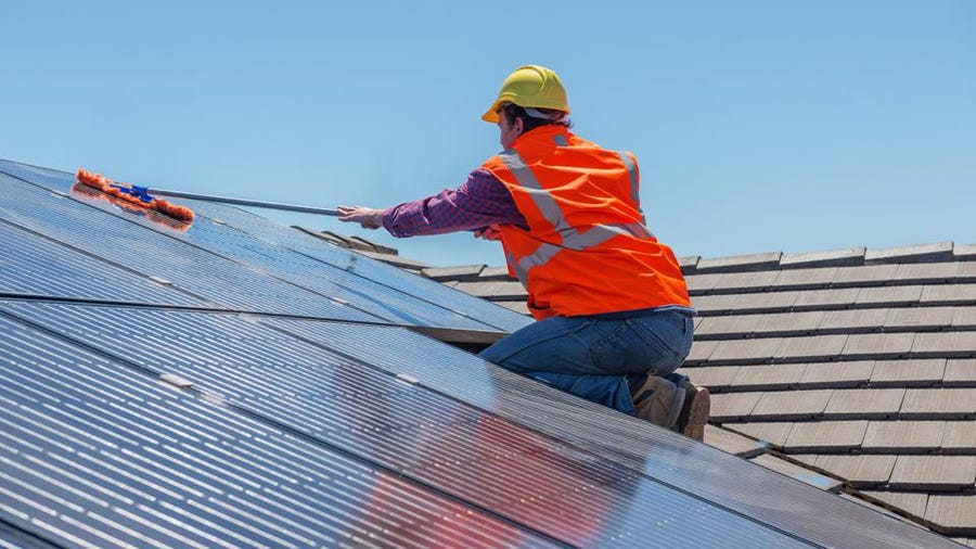 Solar-panel-cleaning tile roof